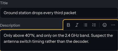 A card's title field and description editor. A small formatting toolbar — bold, italic, bullet list, numbered list, emoji and a more menu — floats above the description while it has focus.