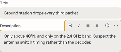 A card's title field and description editor. A small formatting toolbar — bold, italic, bullet list, numbered list, emoji and a more menu — floats above the description while it has focus.